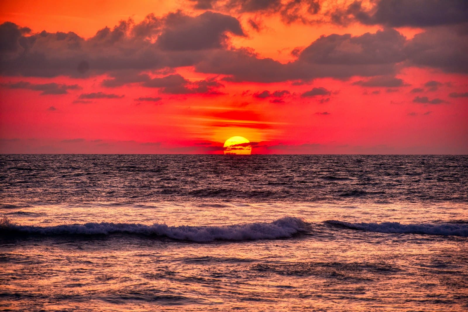Acapulco — ocean waves crashing on shore during sunset