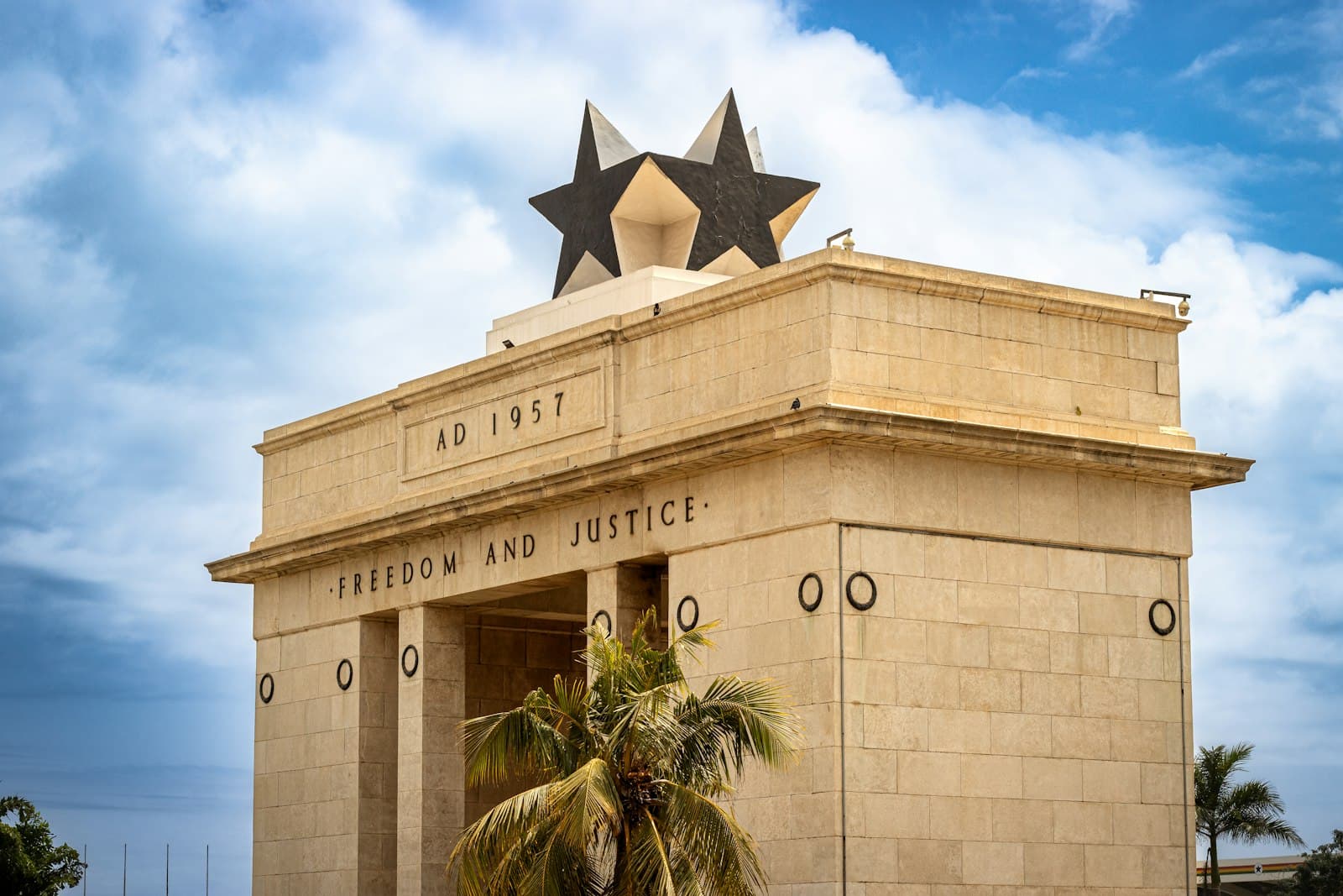 Accra — A building with three stars on top of it