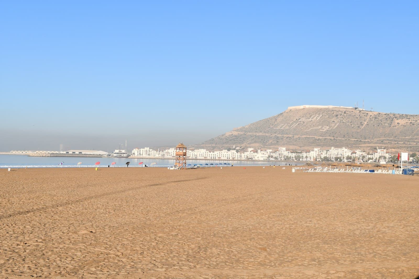 Agadir — a beach with a mountain in the background