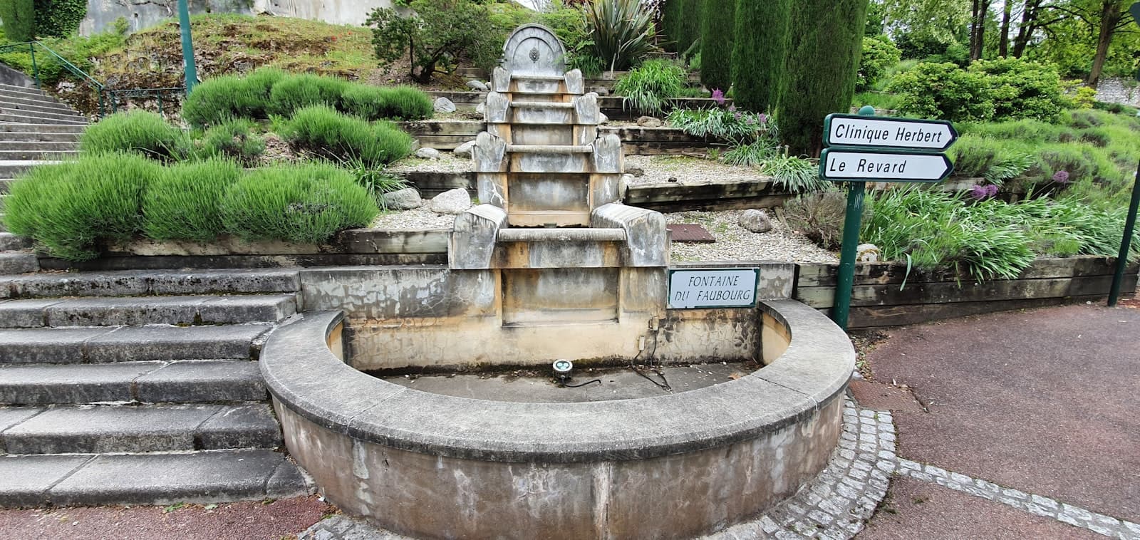 Aix-les-Bains — a stone fountain in a park with steps leading up to it