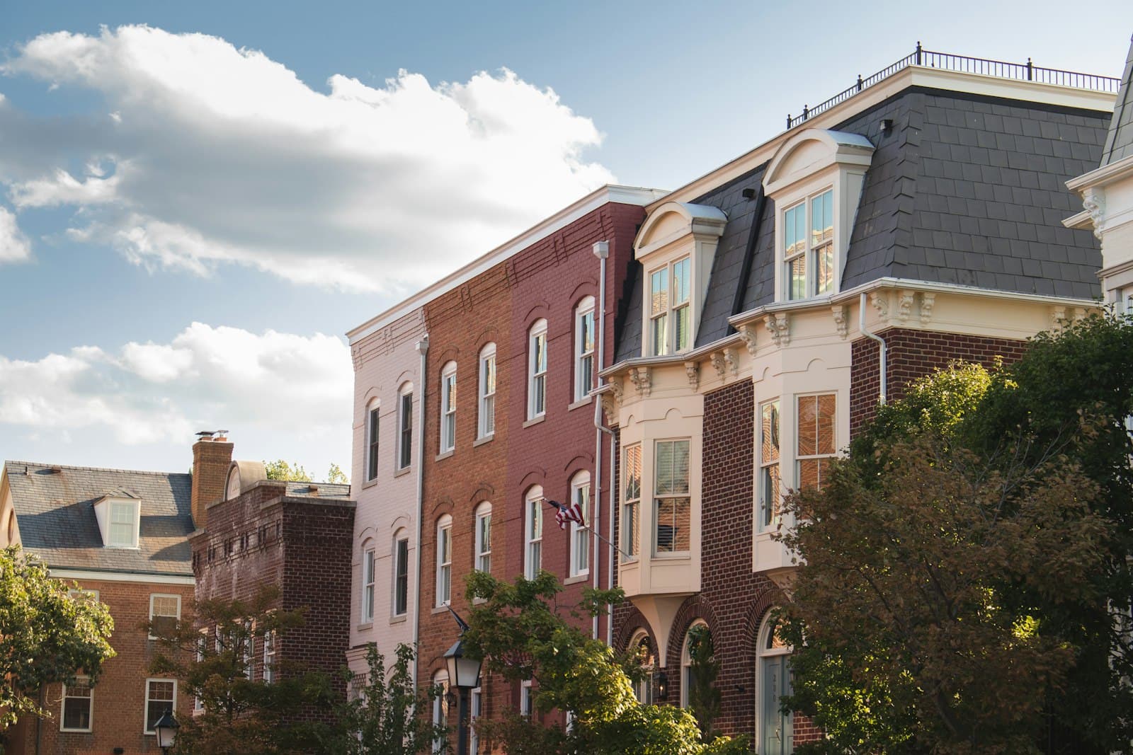Alexandria — a row of brick buildings with trees in front of them