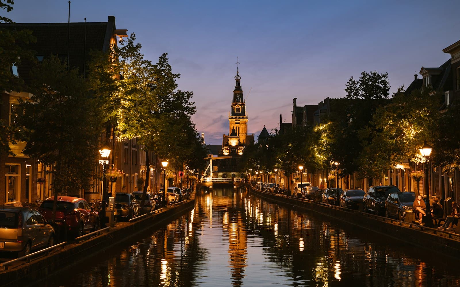 Alkmaar — A canal with a clock tower in the background