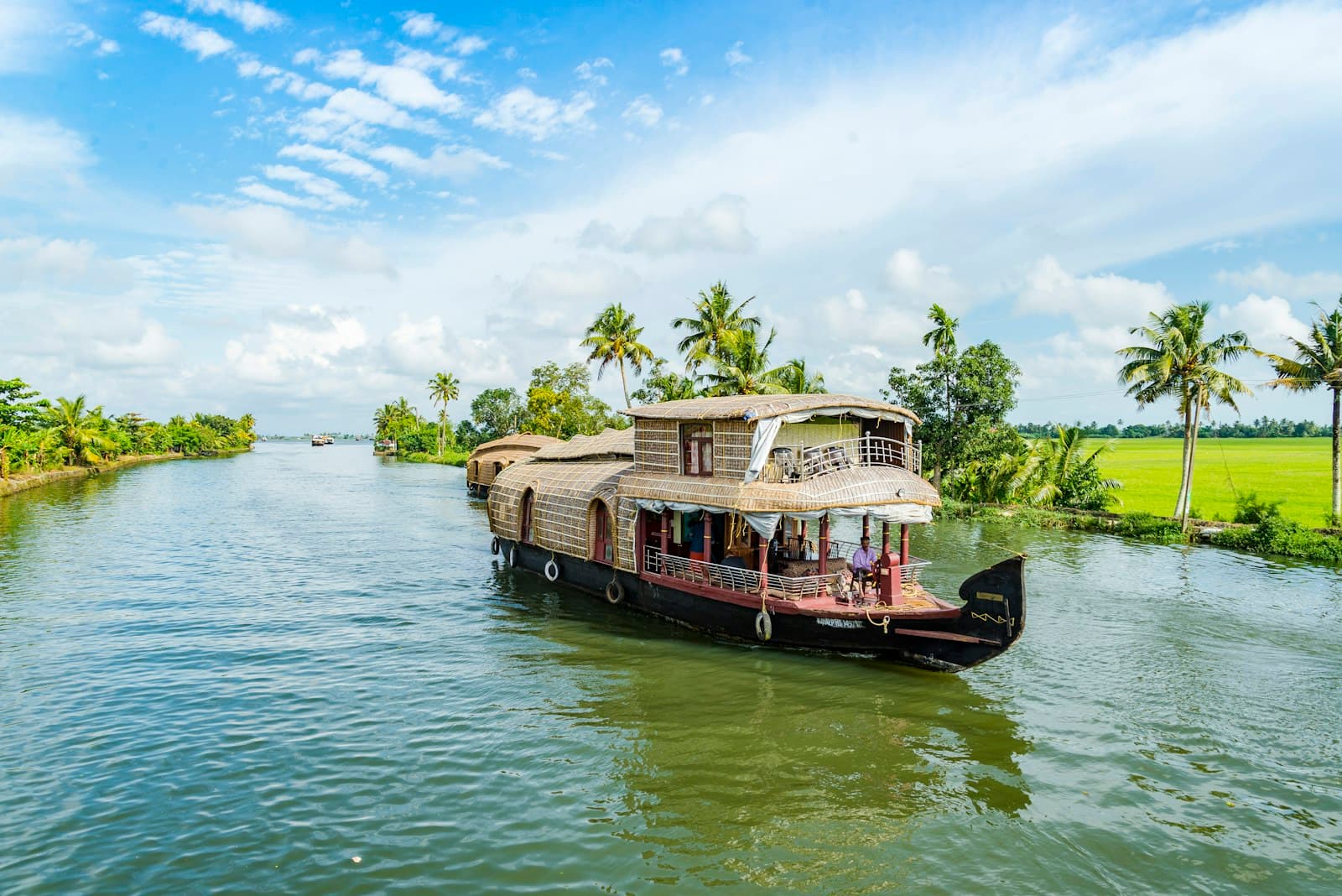 Alappuzha — brown wooden boat on body of water during daytime