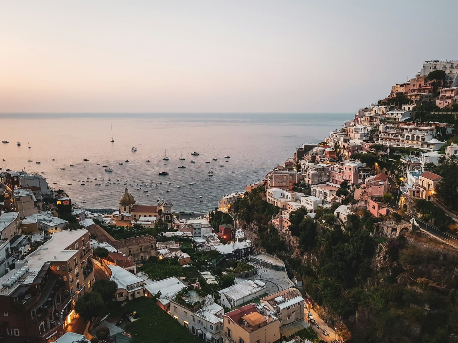Amalfi — aerial view of city buildings near body of water during daytime