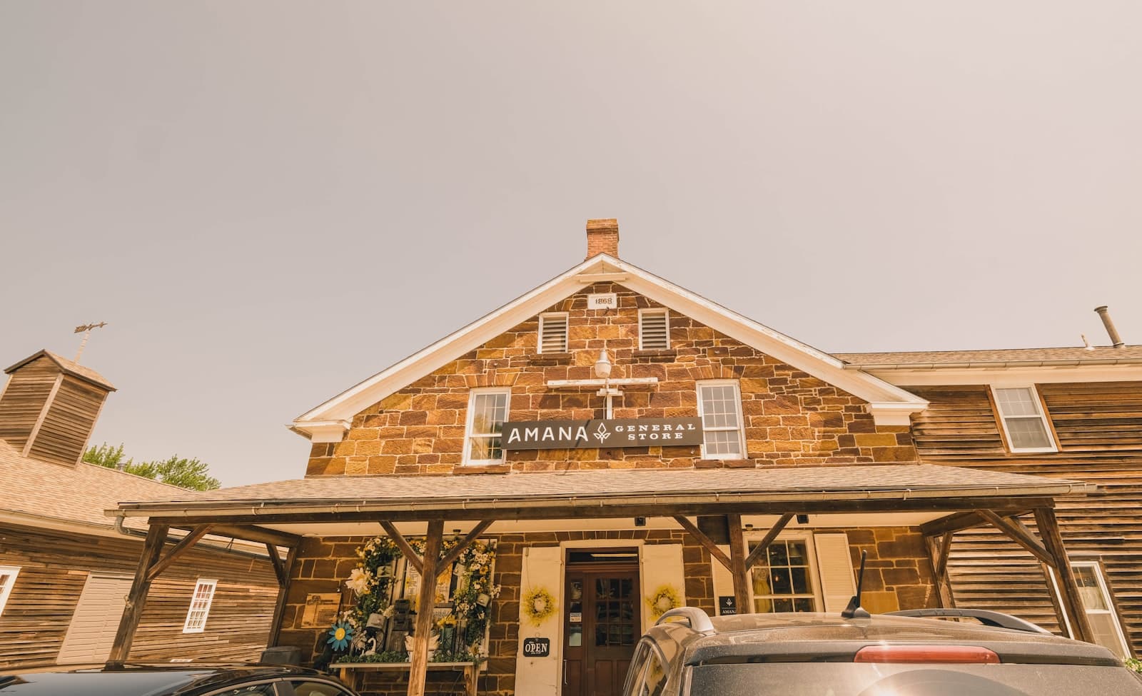 Amana — a car is parked in front of a building