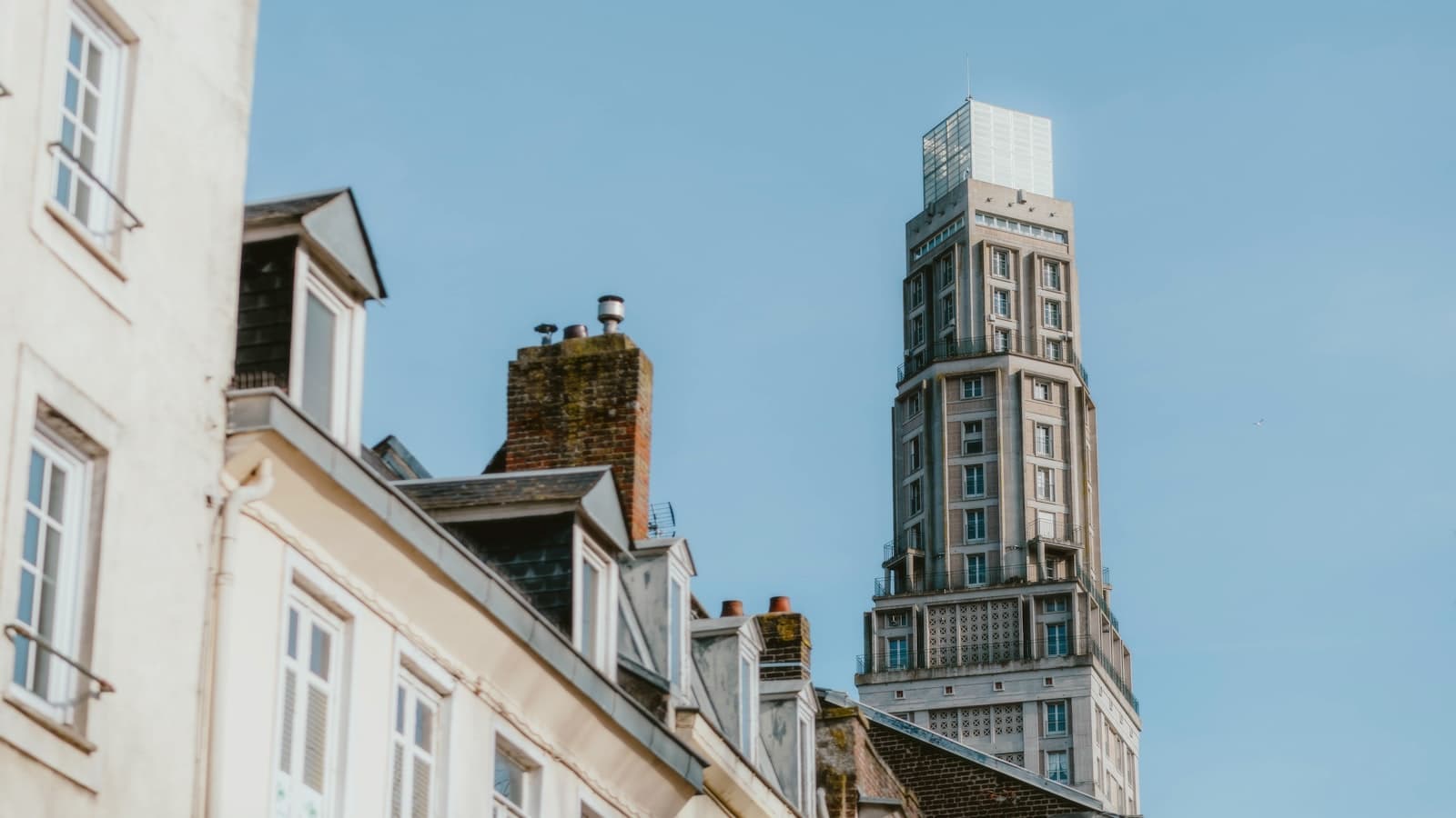 Amiens — A tall building with a clock on it's side