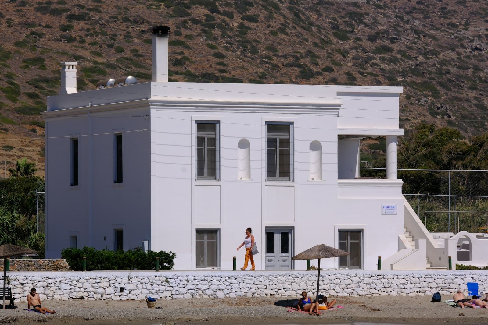 Amorgos — A large white house sitting on top of a beach