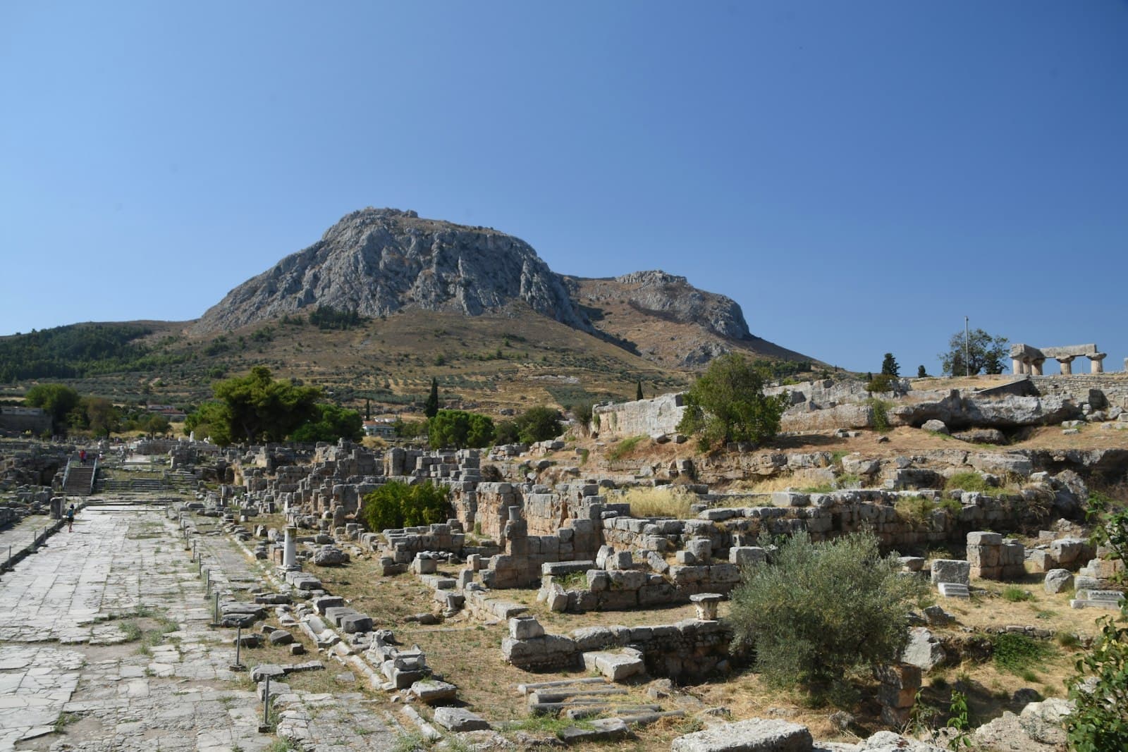 Ancient Corinth — green trees on mountain under blue sky during daytime