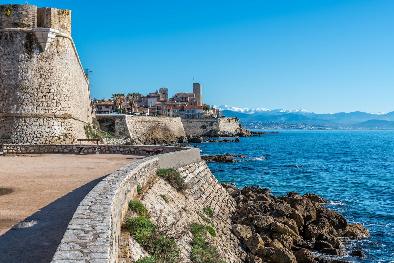 Antibes — brown concrete building near sea during daytime