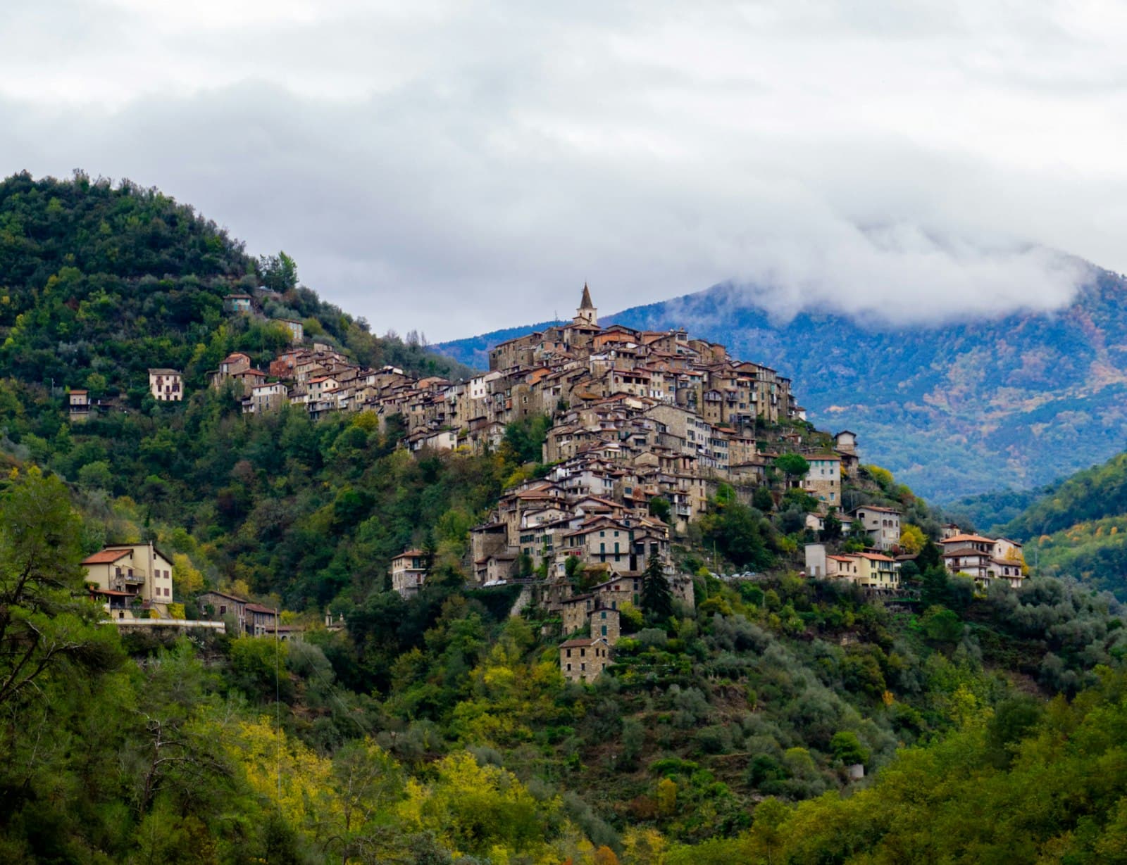 Apricale — A picturesque town nestled on a lush hillside.