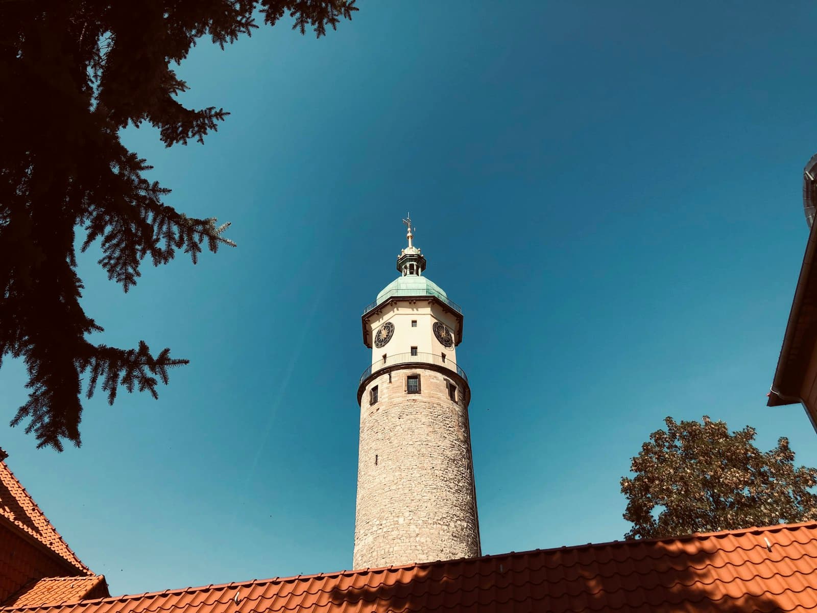 Arnstadt — white and brown concrete lighthouse under blue sky during daytime