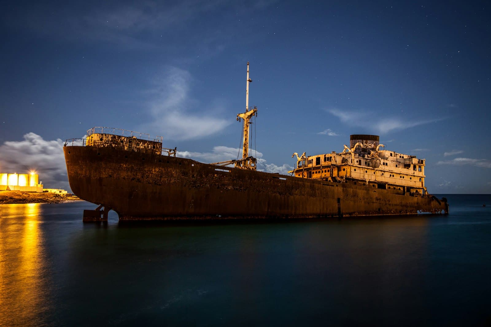 Arrecife — a large rusted ship sitting on top of a body of water