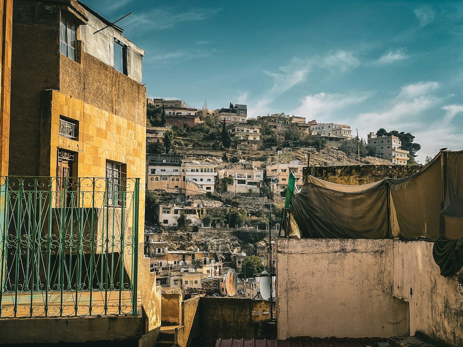 As-Salt — a view of a city with a hill in the background
