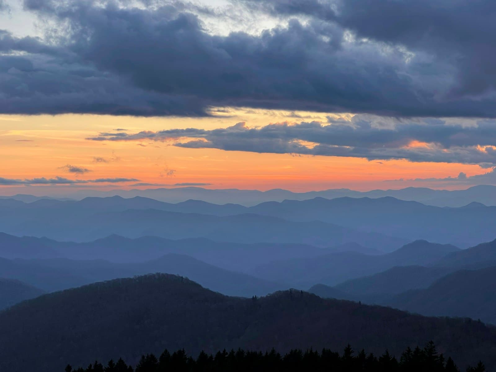 Asheville — a view of a mountain range at sunset