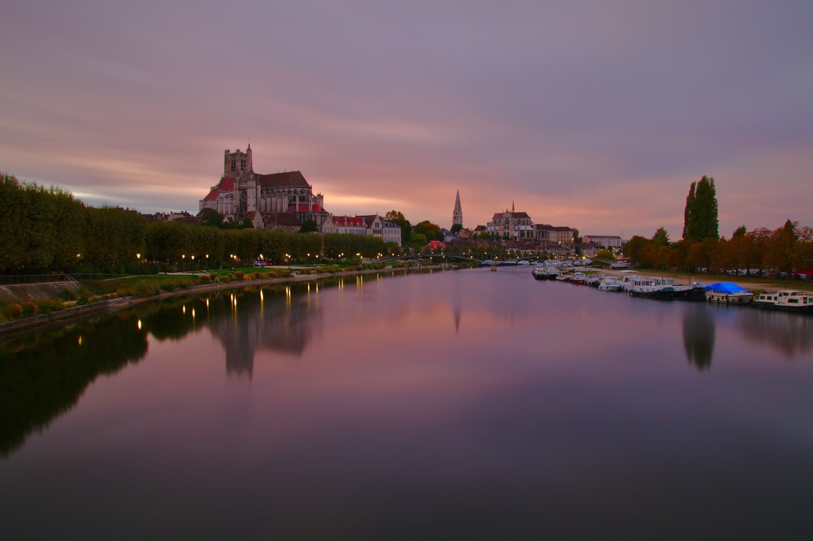 Auxerre — calm body of water near village during golden hour