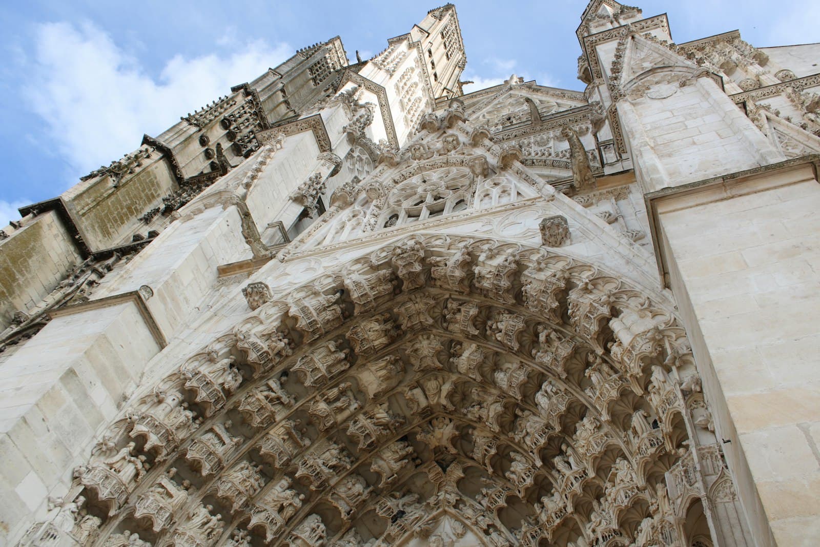 Auxerre — a very tall building with a clock on it's side