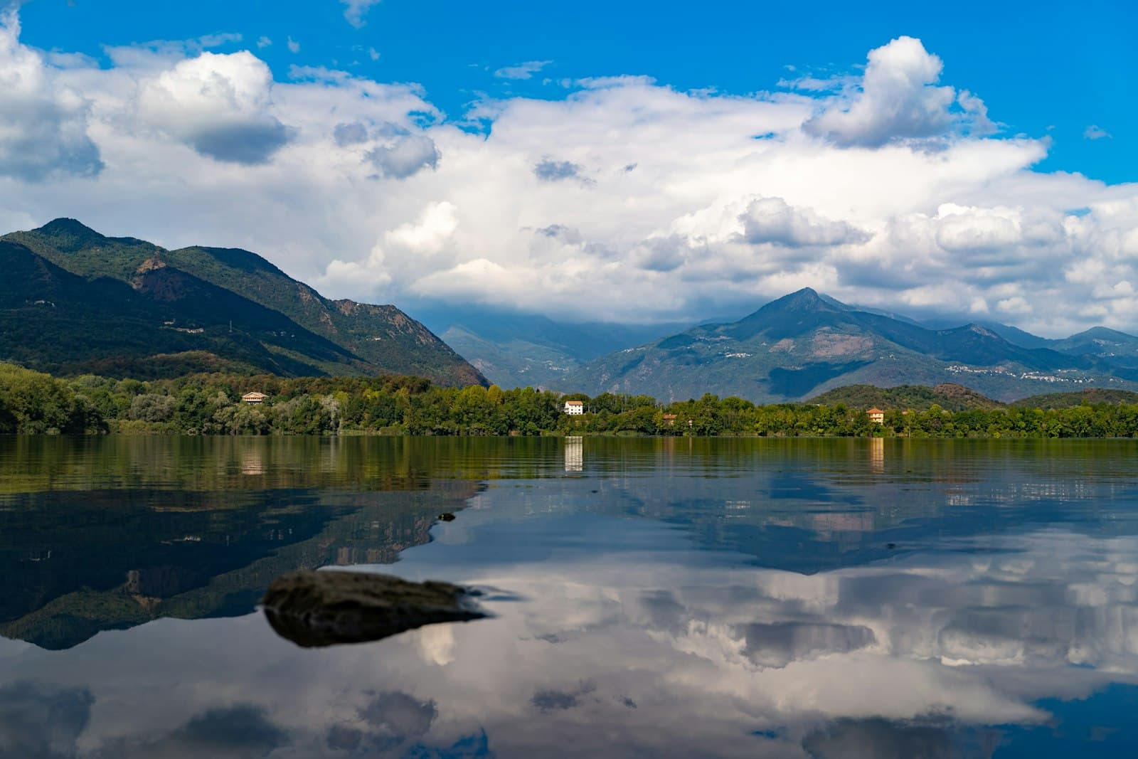 Avigliana — a body of water with mountains in the background