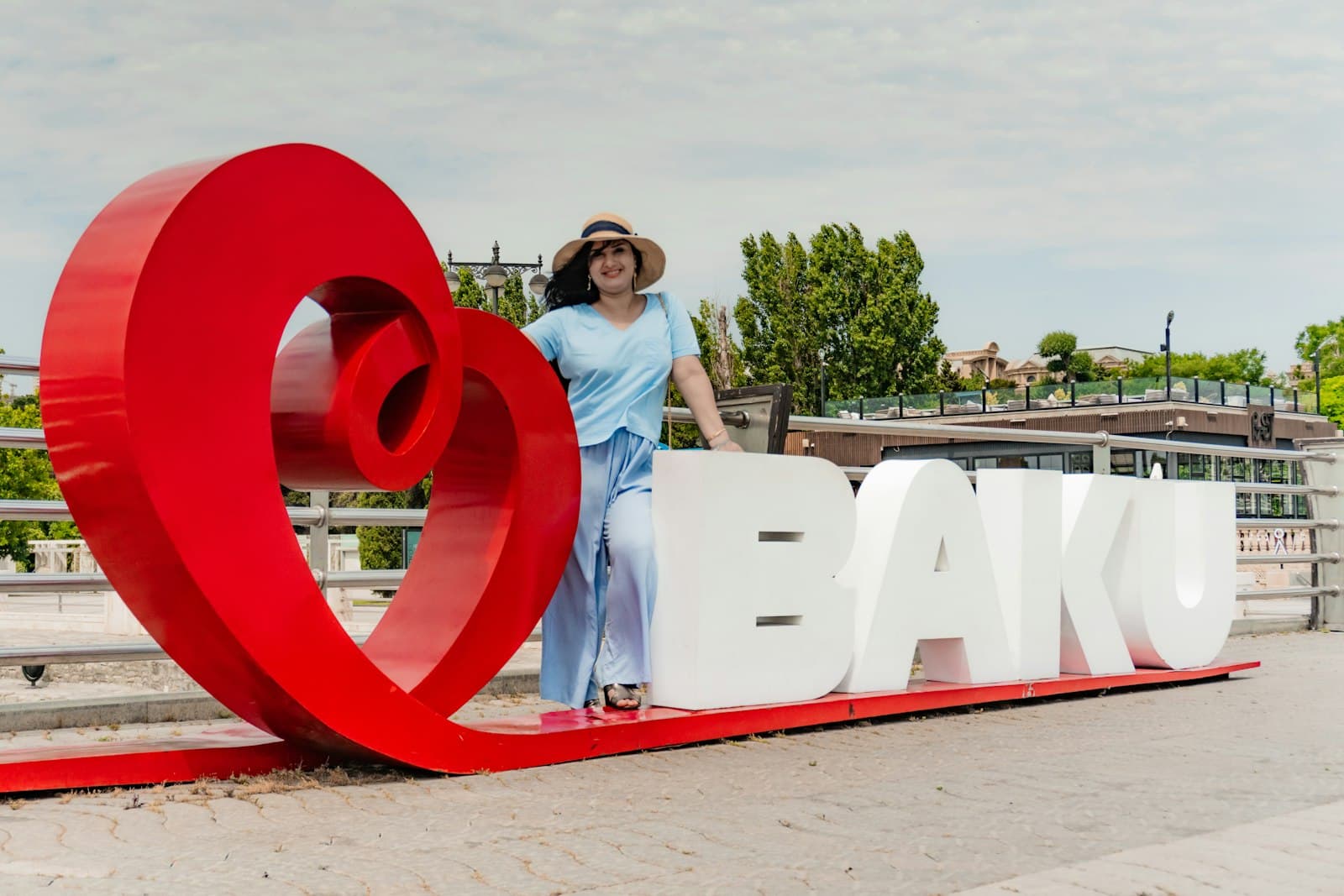 Baalbek — Woman with a large red heart and "baku" sign.