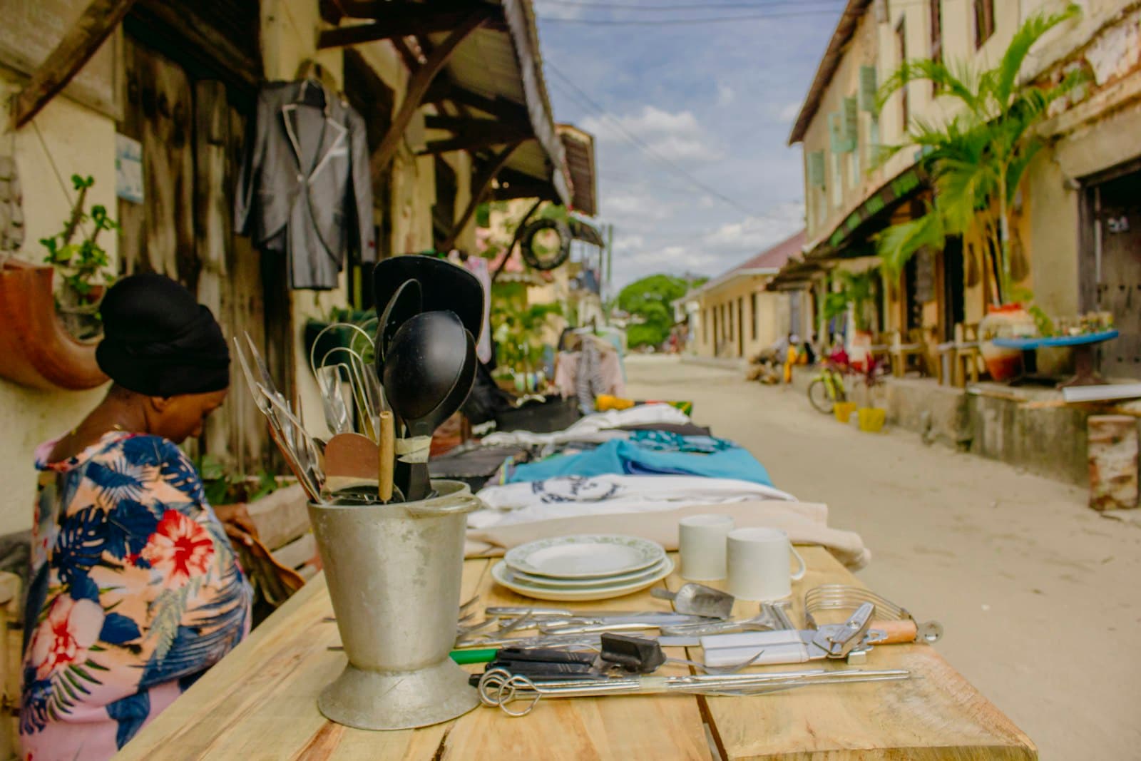 Bagamoyo — white plastic bucket on brown wooden table
