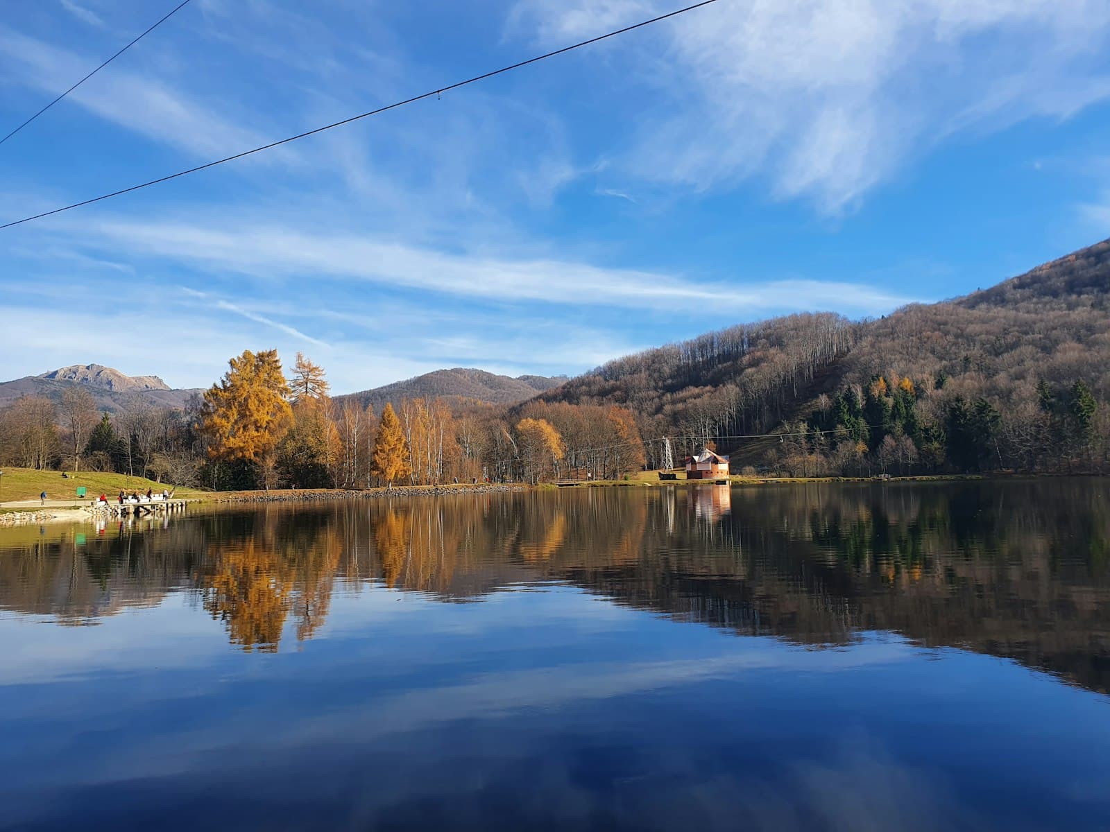 Baia Mare — a lake with trees and mountains in the background
