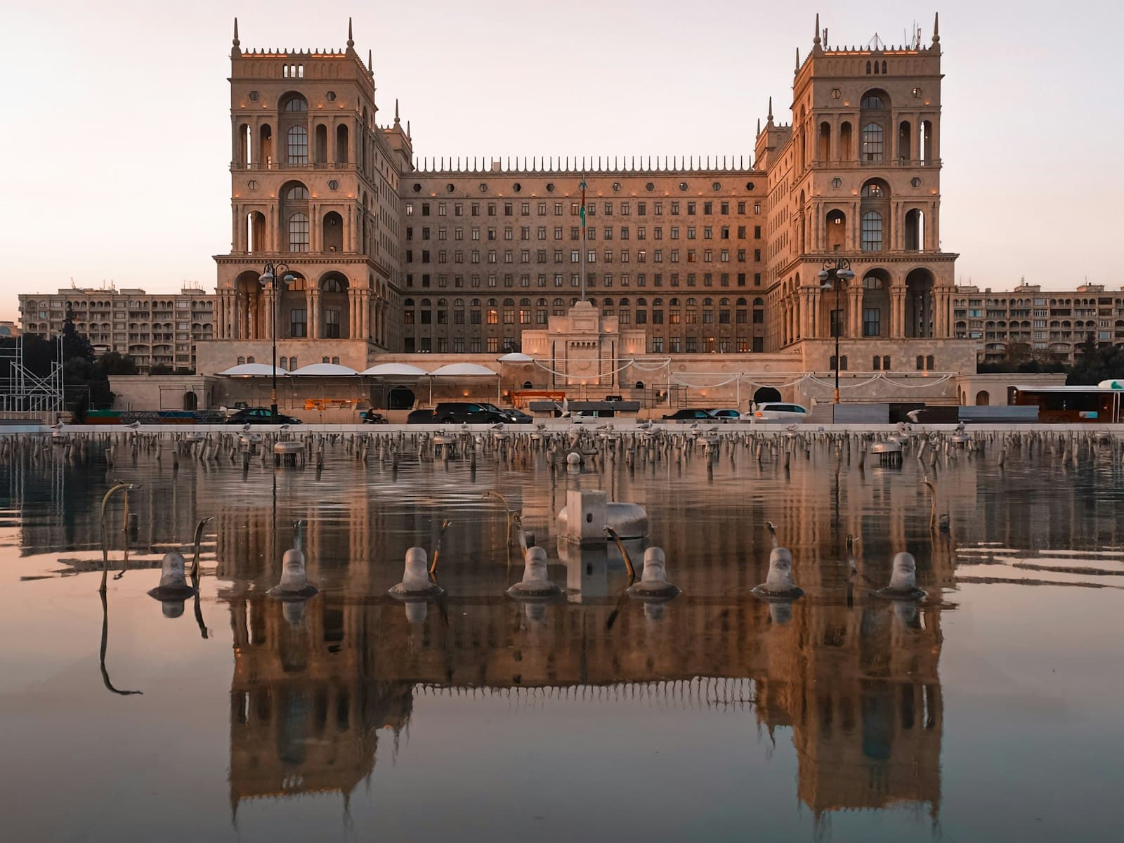 Baku — brown concrete building near body of water during daytime