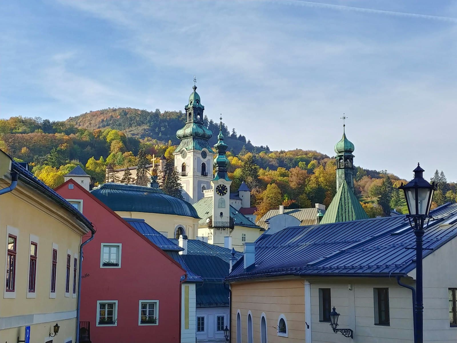Banská Štiavnica — a view of a town with a church on a hill in the background