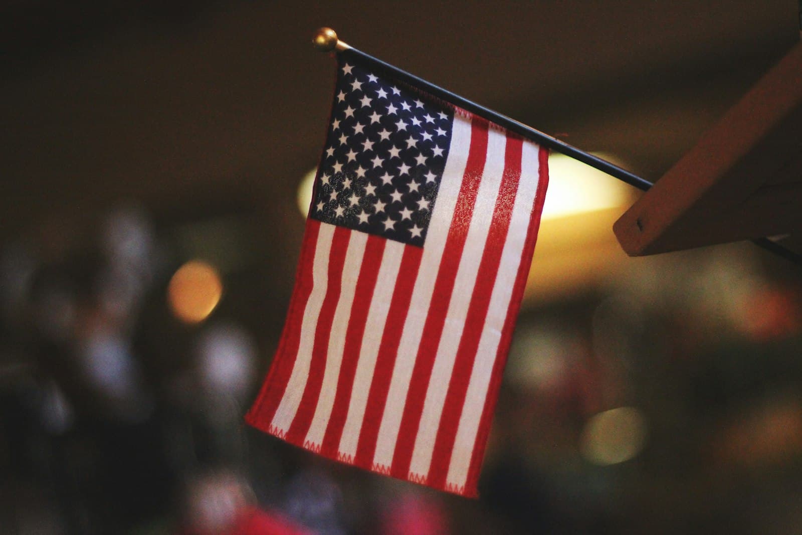 Beacon — selective focus photography of USA flaglet