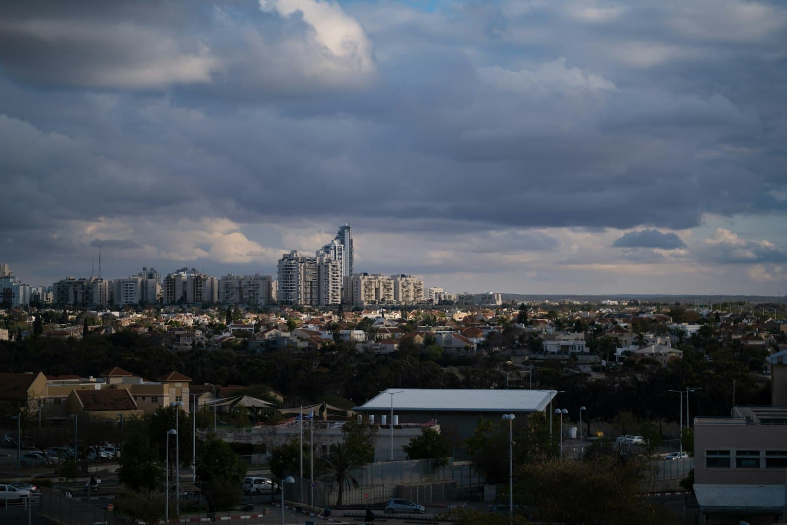 Beersheba — a view of a city with tall buildings under a cloudy sky
