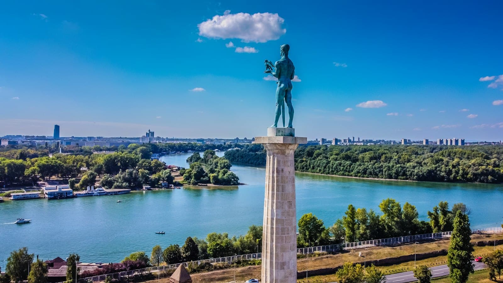 Belgrade — a statue of a man standing on top of a tower