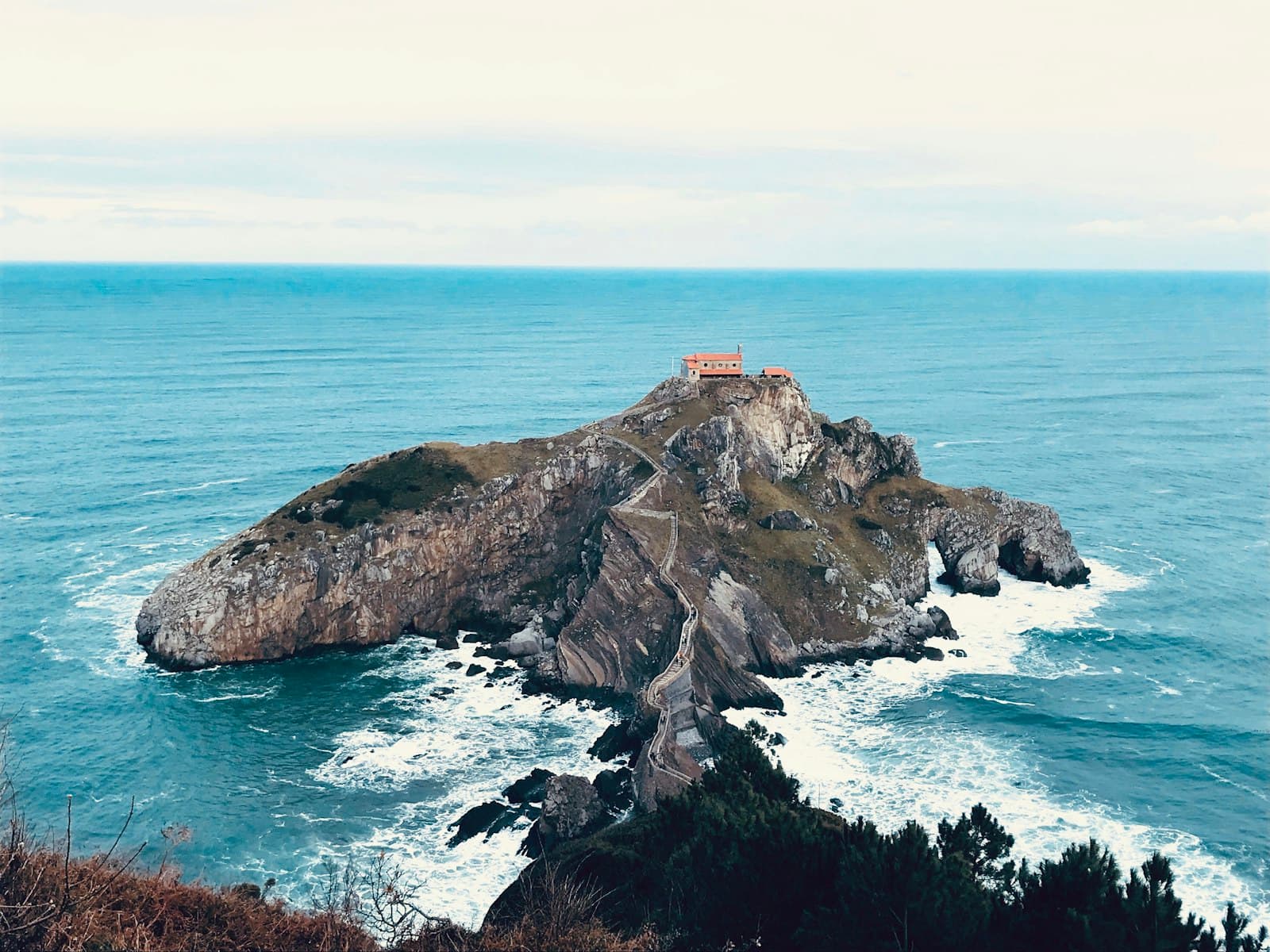 Bermeo — brown rock formation on sea during daytime