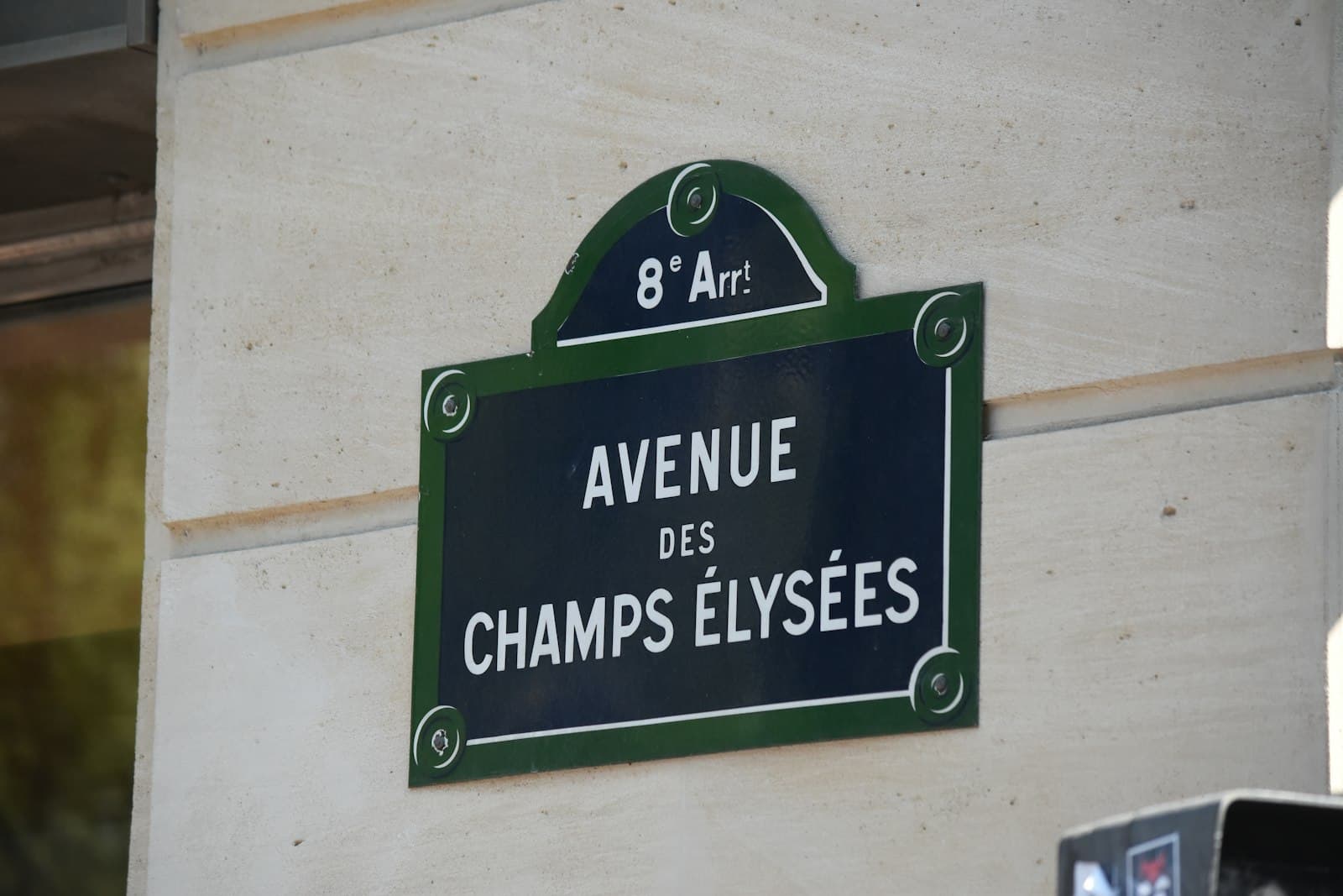 Beuvron-en-Auge — a sign on the side of a building that says avenue des champs elysees