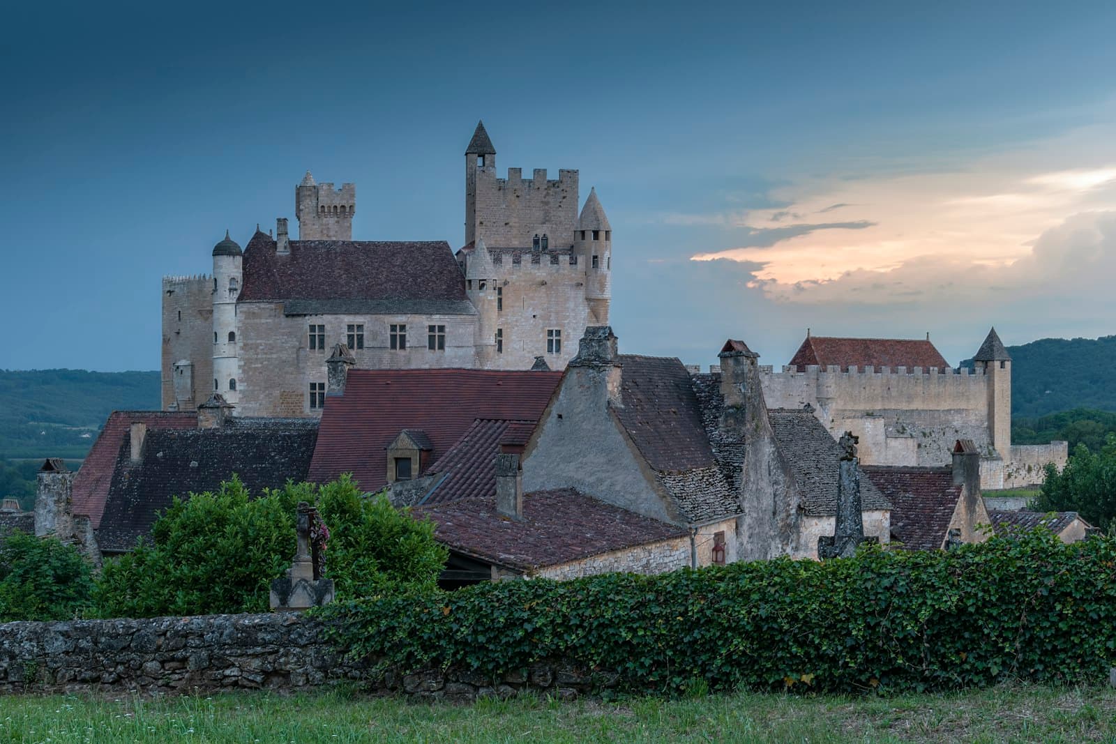 Beynac-et-Cazenac — a castle with a clock tower on top of it