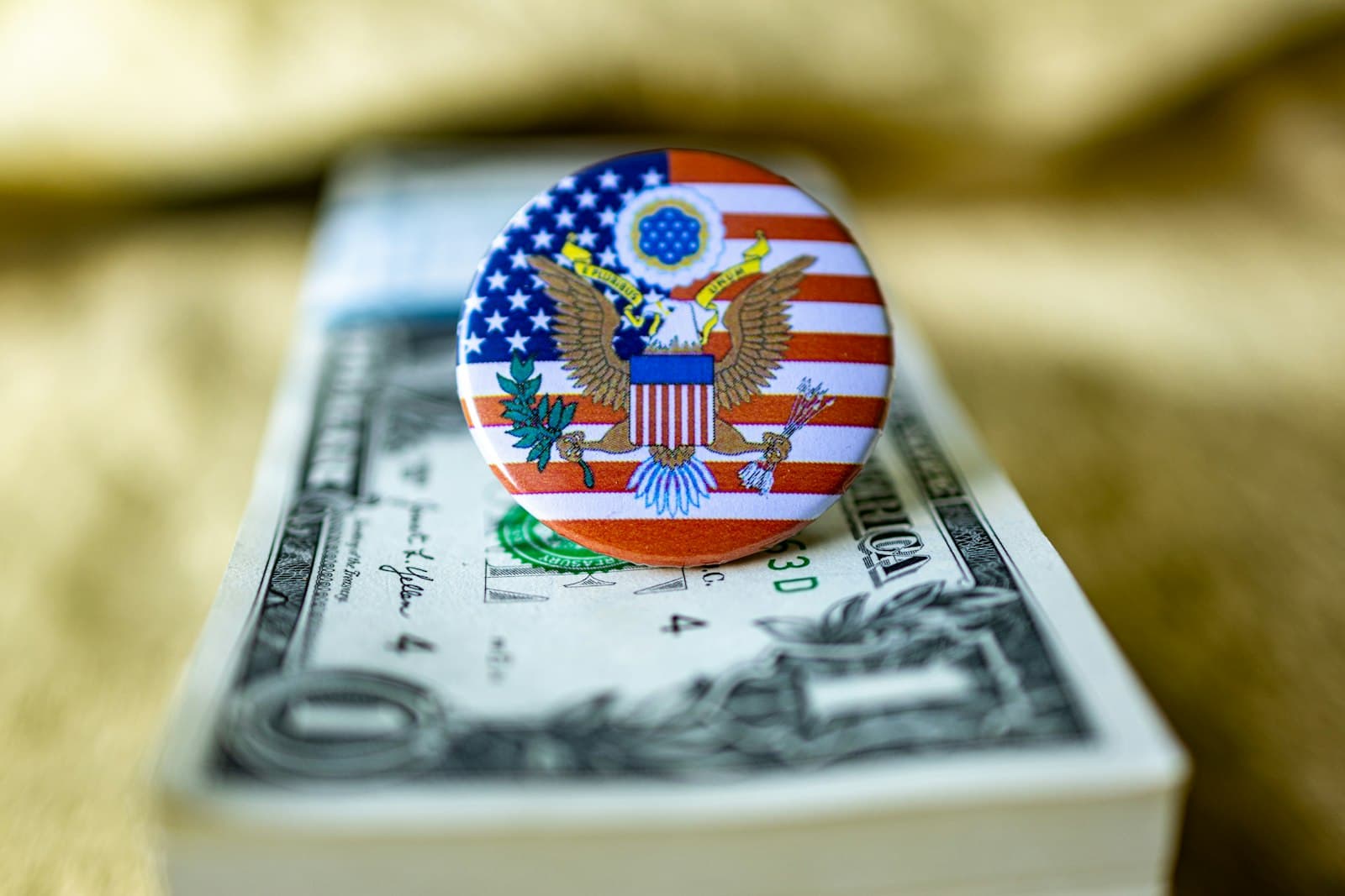 Billings — An american flag pin sitting on top of a one dollar bill