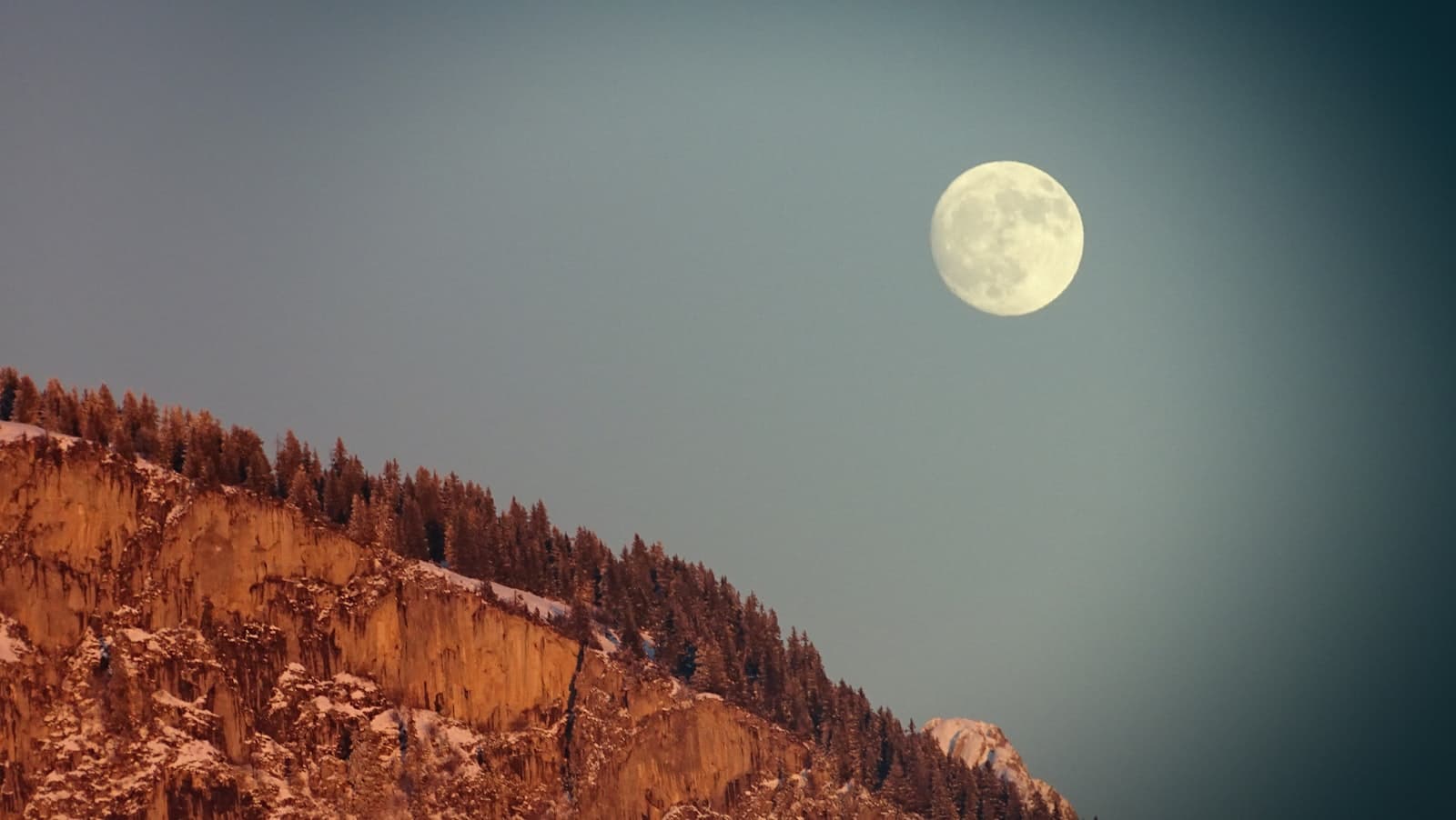 Biot — brown rocky mountain under full moon