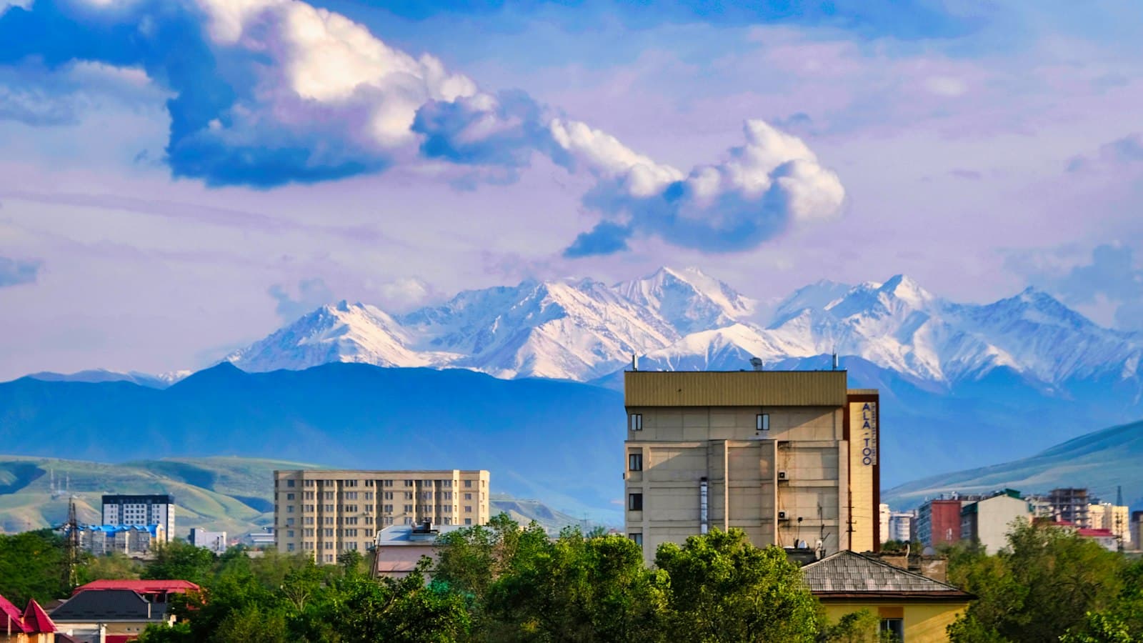 Bishkek — a view of a city with mountains in the background