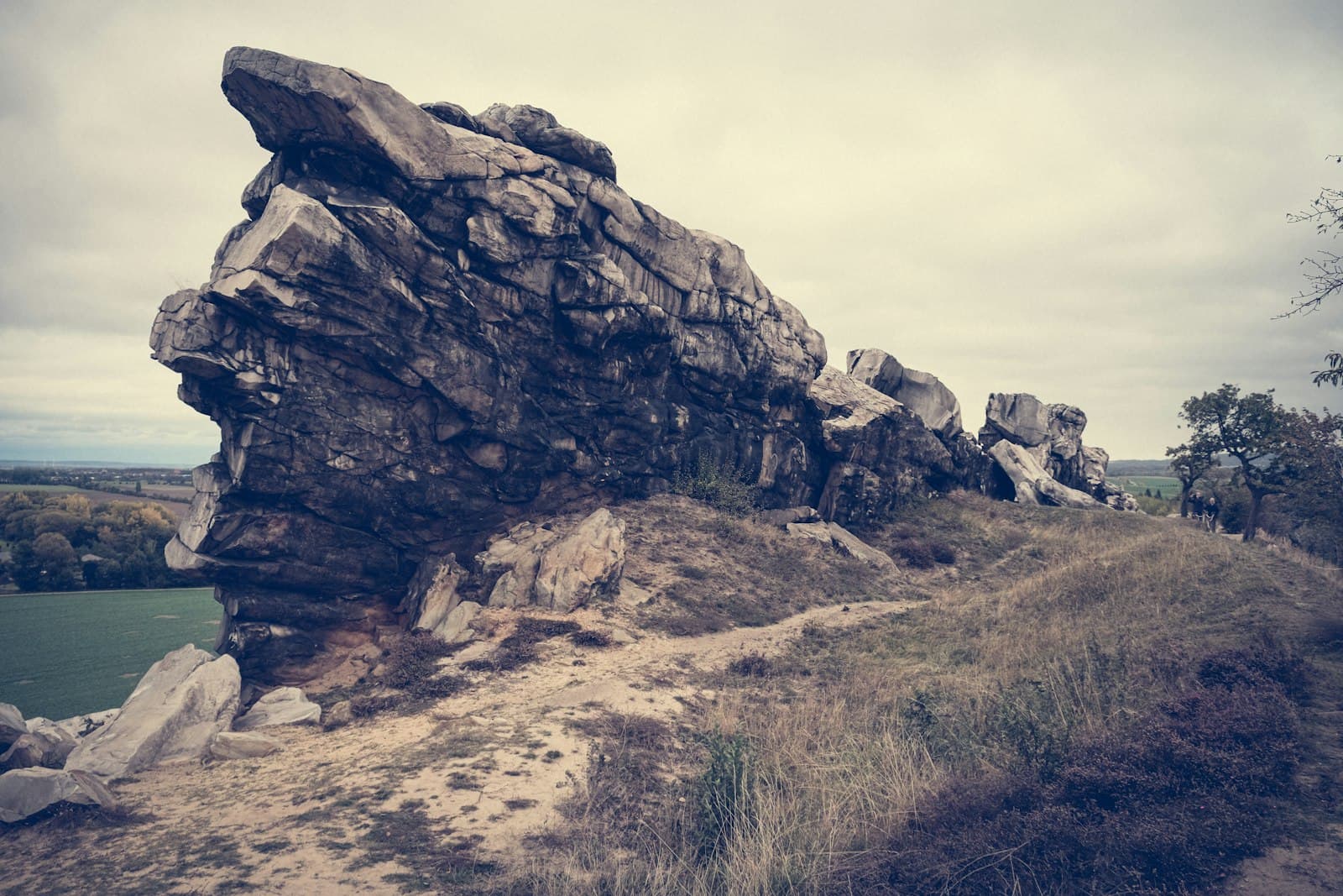 Blankenburg — a large rock sitting on the side of a dirt road