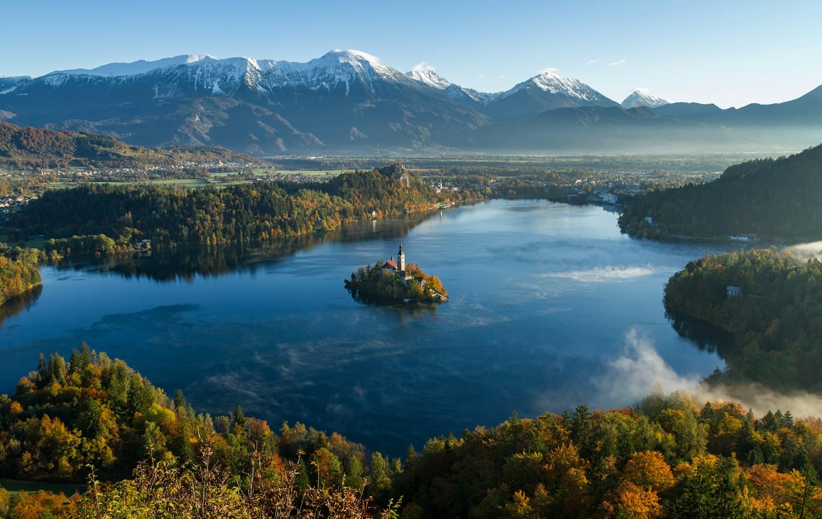 Bled — island surrounded by water and mountains at daytime
