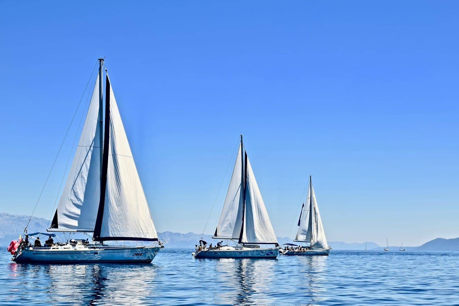 Bol — three sail boats on water during daytime
