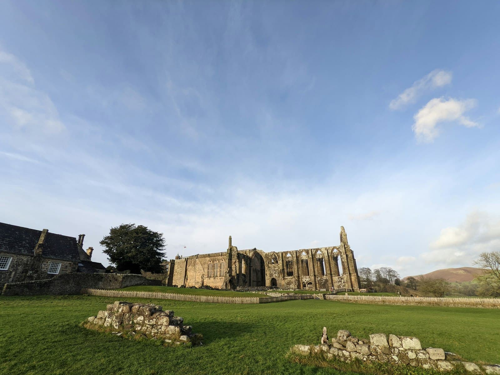 Bolton — a large stone building sitting on top of a lush green field