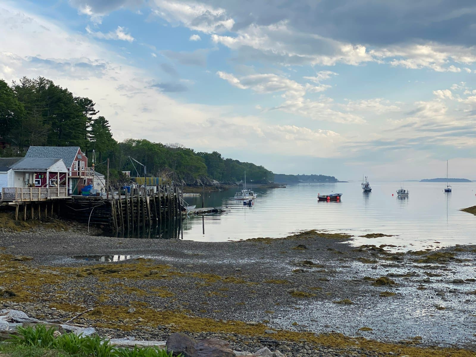 Boothbay Harbor — white and black boat on sea dock under cloudy sky during daytime