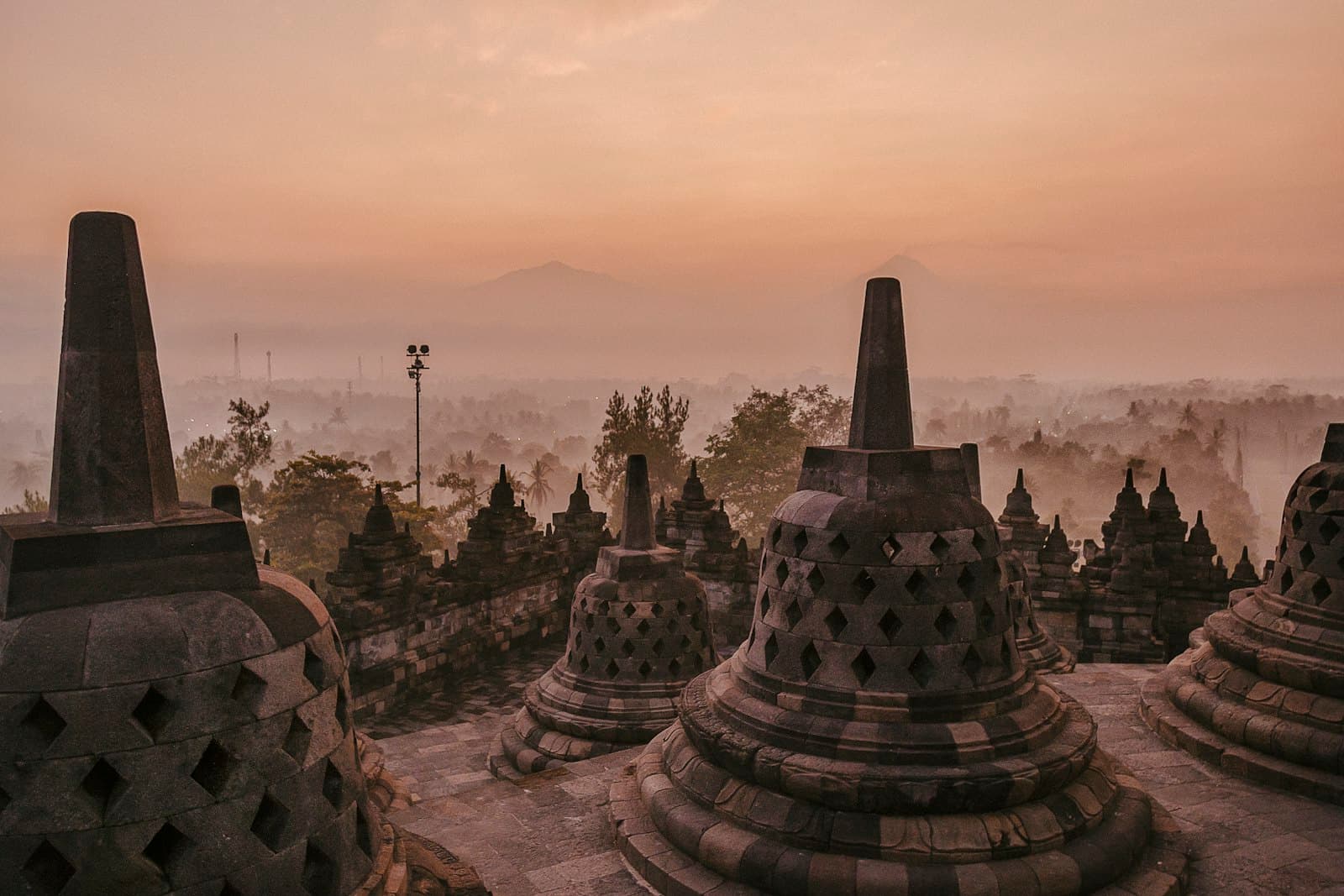 Borobudur — gold and white temple under blue sky during daytime