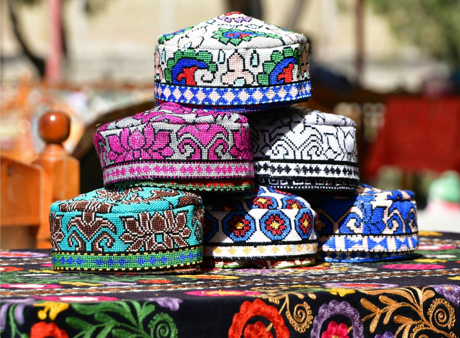 Boukhara — a group of colorful hats sitting on top of a table