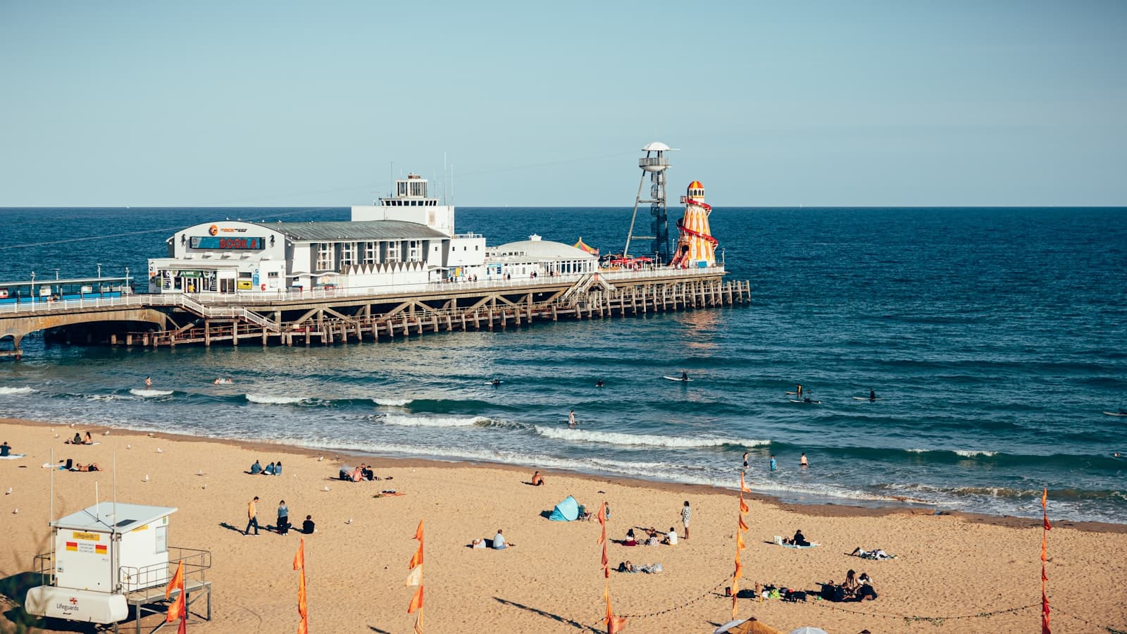 Bournemouth — a pier with people on it next to a large body of water
