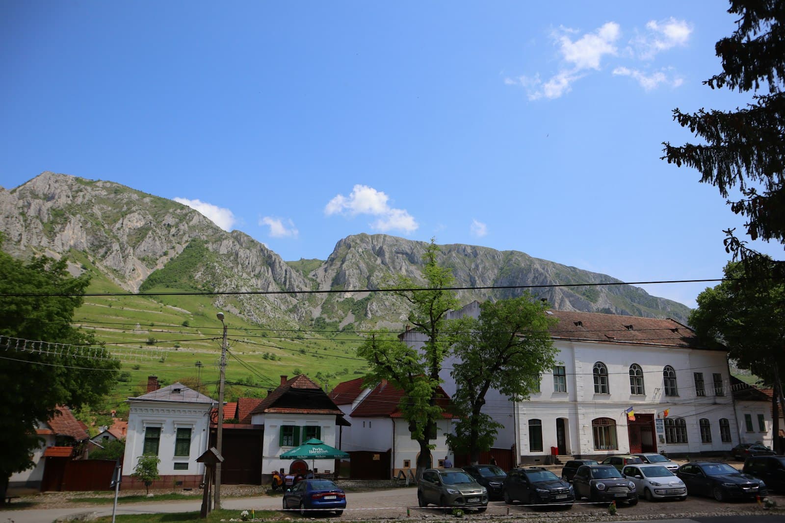 Breb — a large white building with a mountain in the background