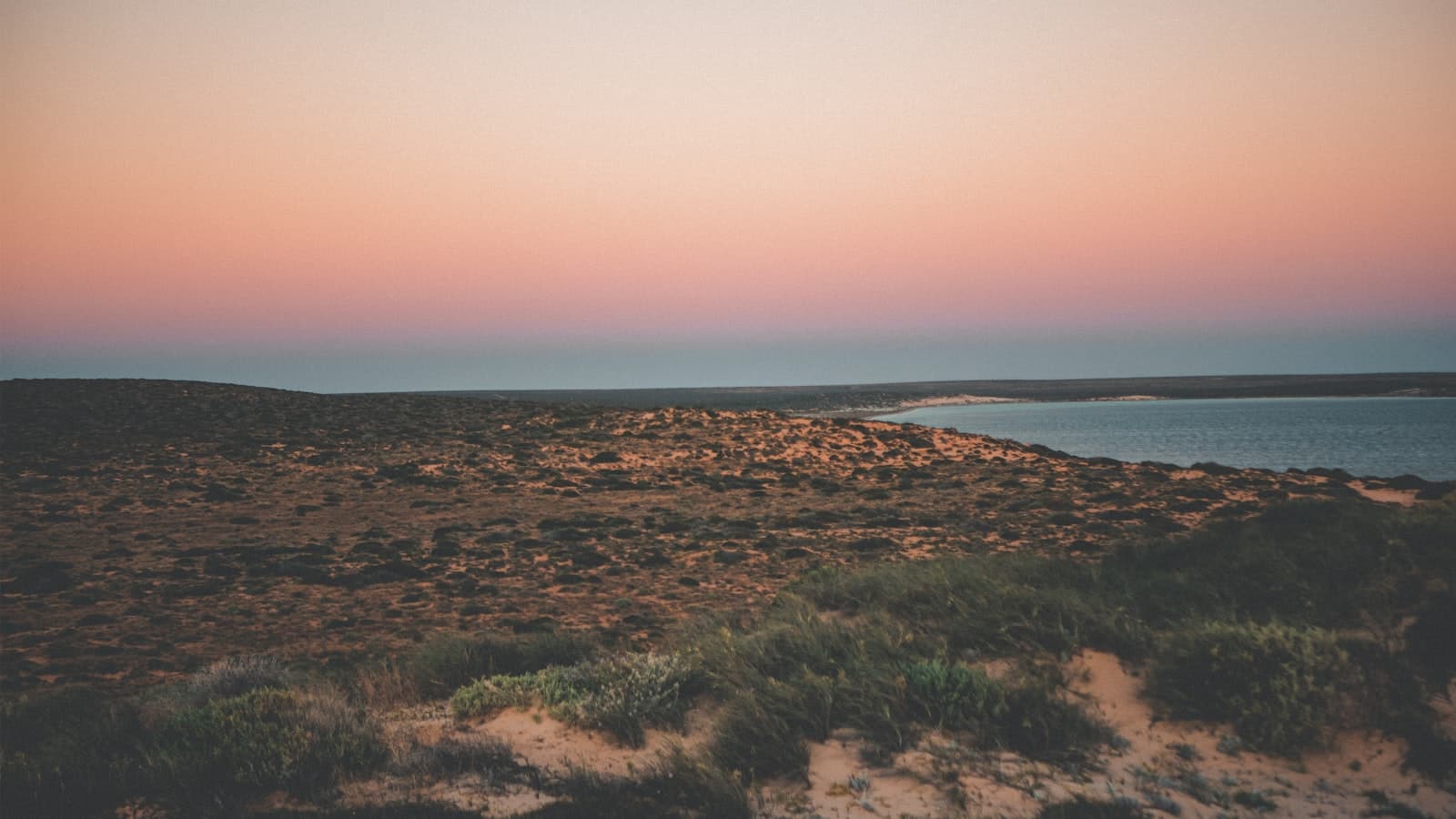 Broken Hill — green grass field near body of water during daytime