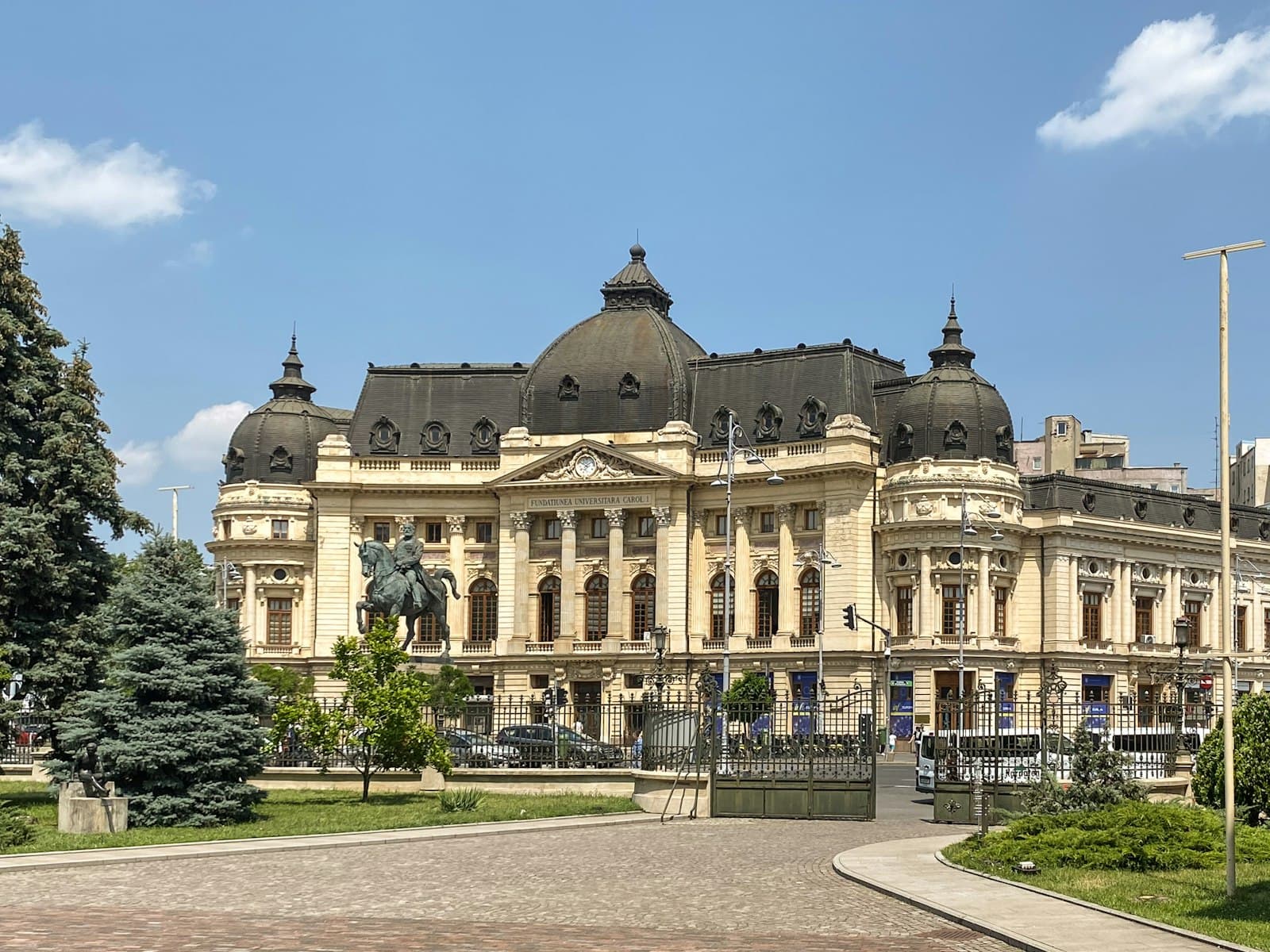 Bucharest — a large building with a clock tower on top of it