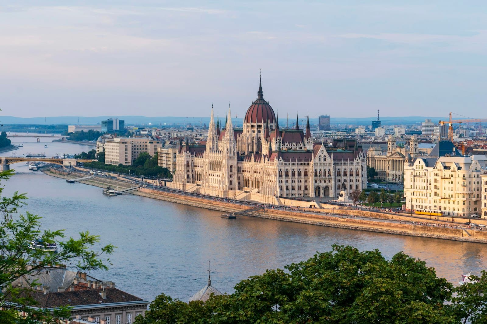 Budapest — brown concrete building near body of water during daytime