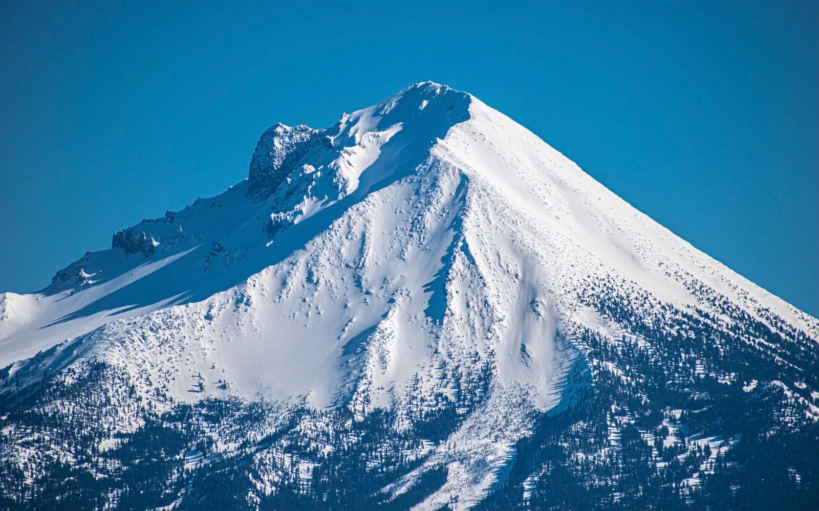 Butte — snow covered mountain under blue sky during daytime