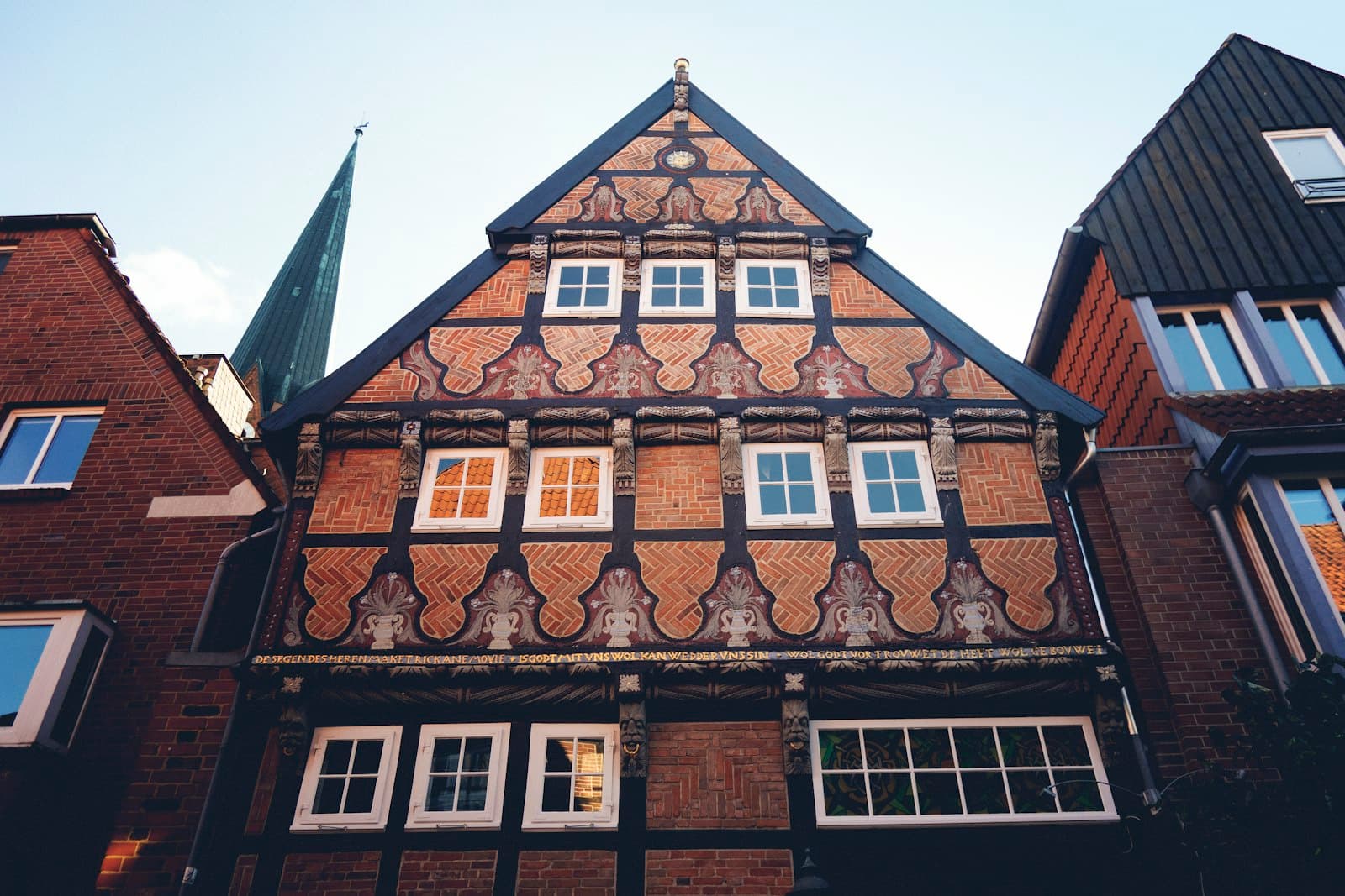 Buxtehude — A tall building with lots of windows next to other buildings