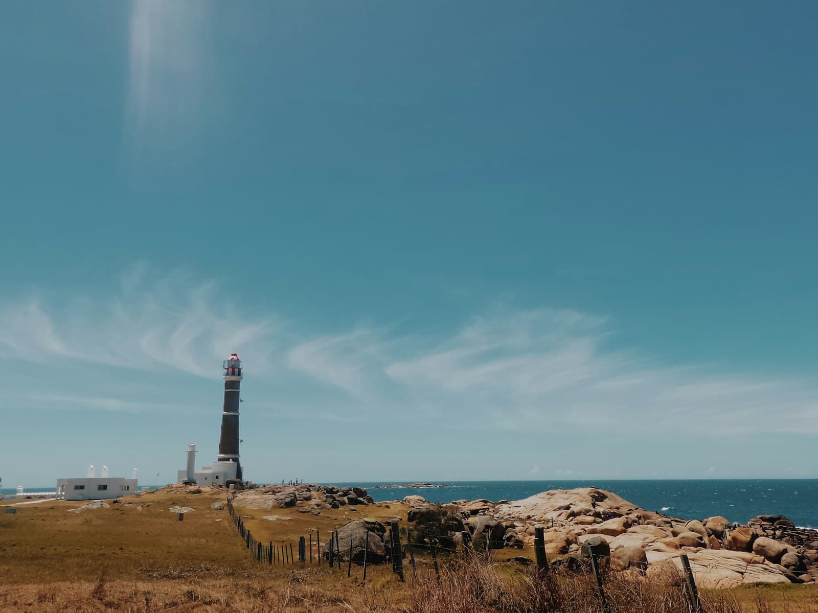 Cabo Polonio — brown and white lighthouse during daytime